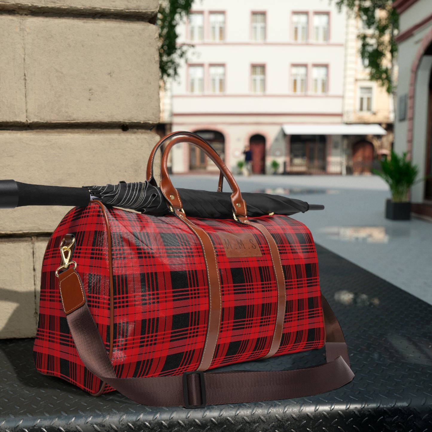 A Custom Plaid Waterproof Travel Bag - Black and Red Plaid Design.